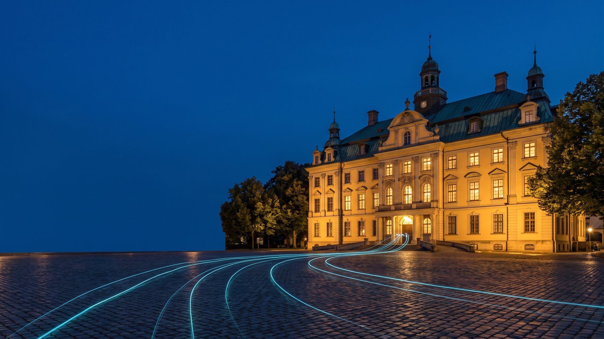Schloss Oldenburg zur blauen Stunde mit leuchtenden Datenlinien (KI-Symbolbild)