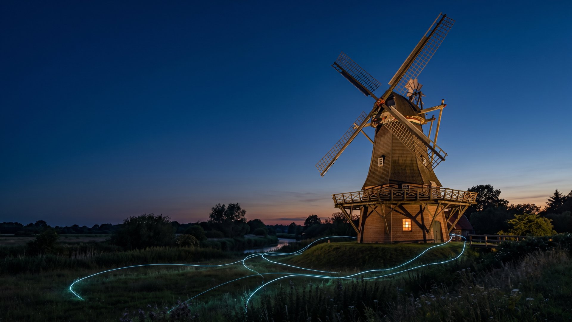 Ritterhuder Mühle zur blauen Stunde mit leuchtenden Datenlinien (KI-Symbolbild)